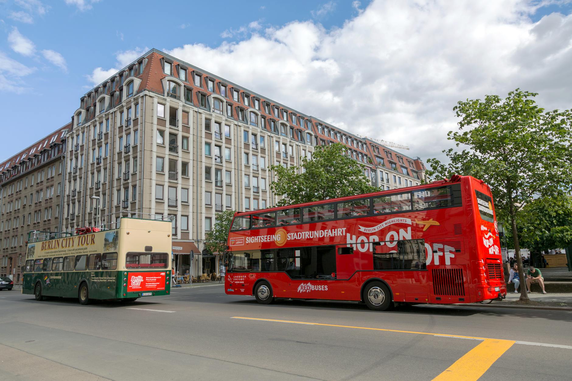 Berlin double-decker bus on city street near landmarks