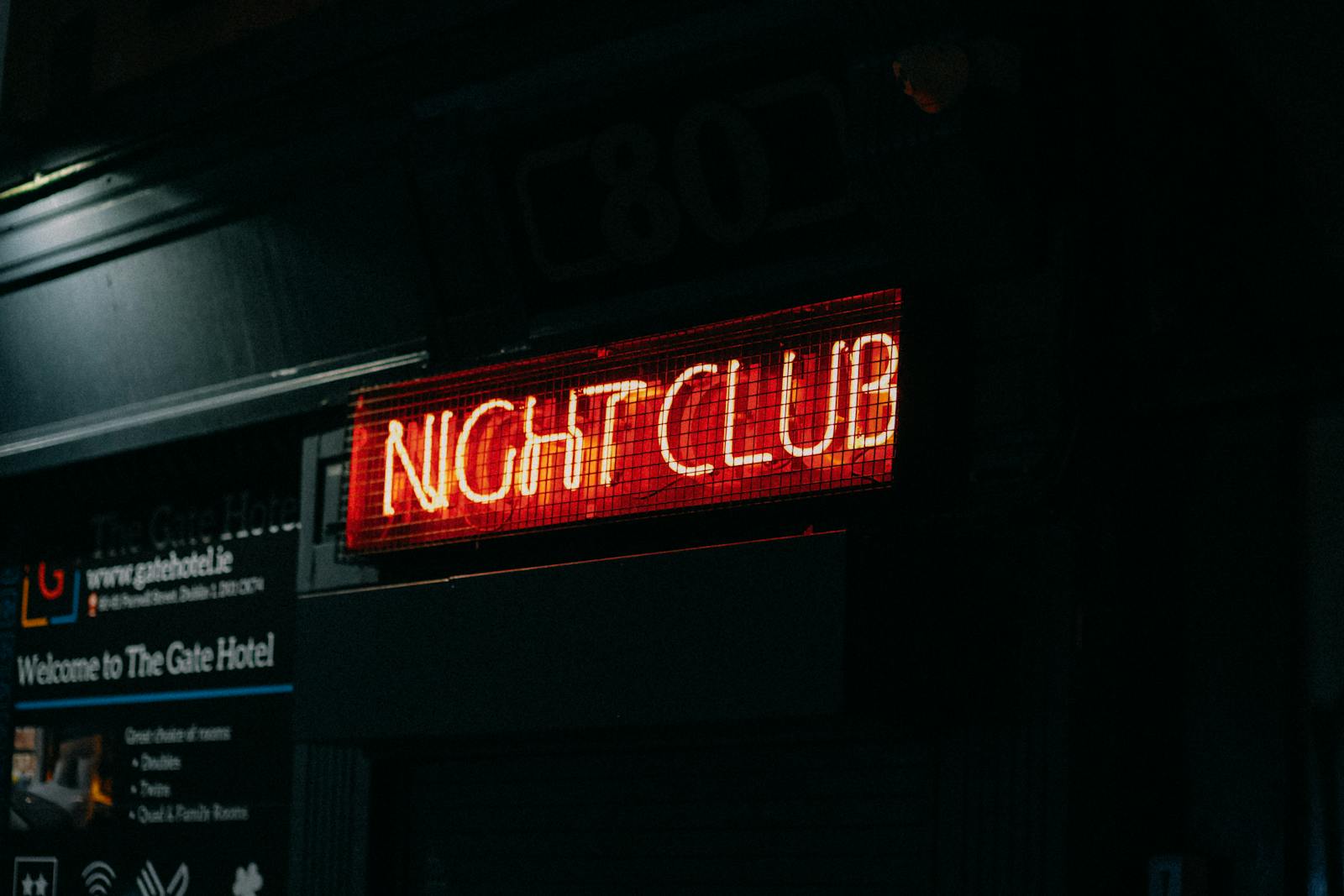 Neon Night Club sign in a dark Berlin street