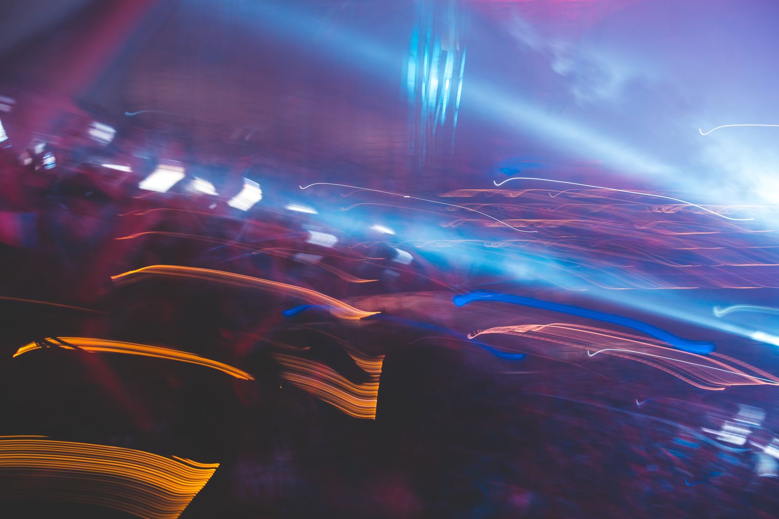 Vibrant colored lights and motion blur in nightclub