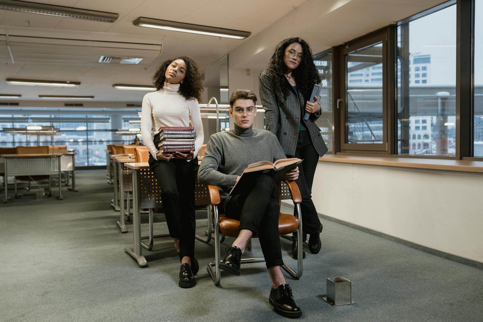Multiracial college students studying in a library