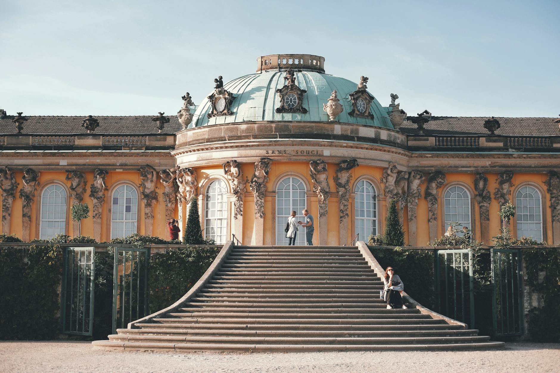 Sanssouci Palace in Potsdam with yellow Rococo facade and gardens