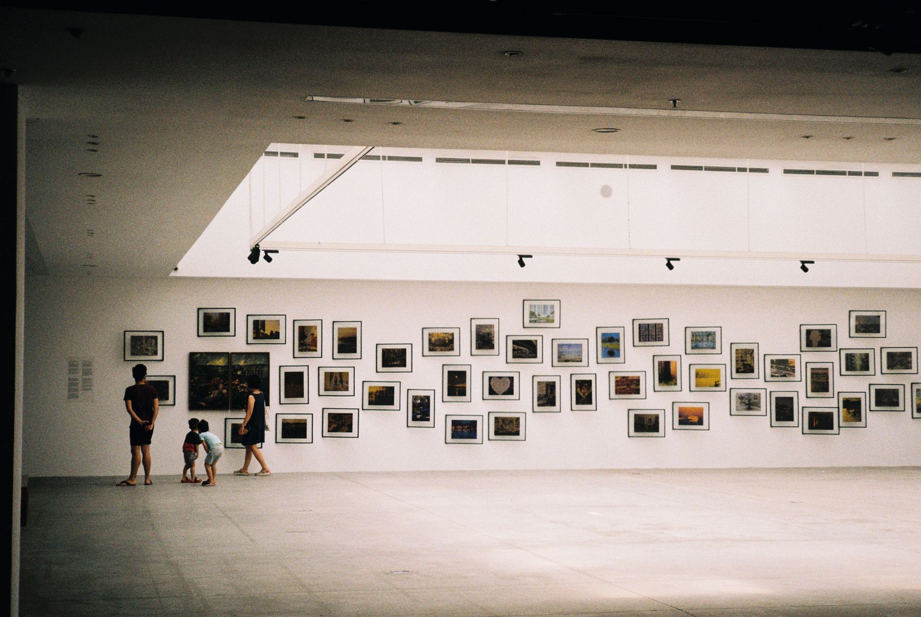 Contemporary art gallery exhibition with viewers in Berlin