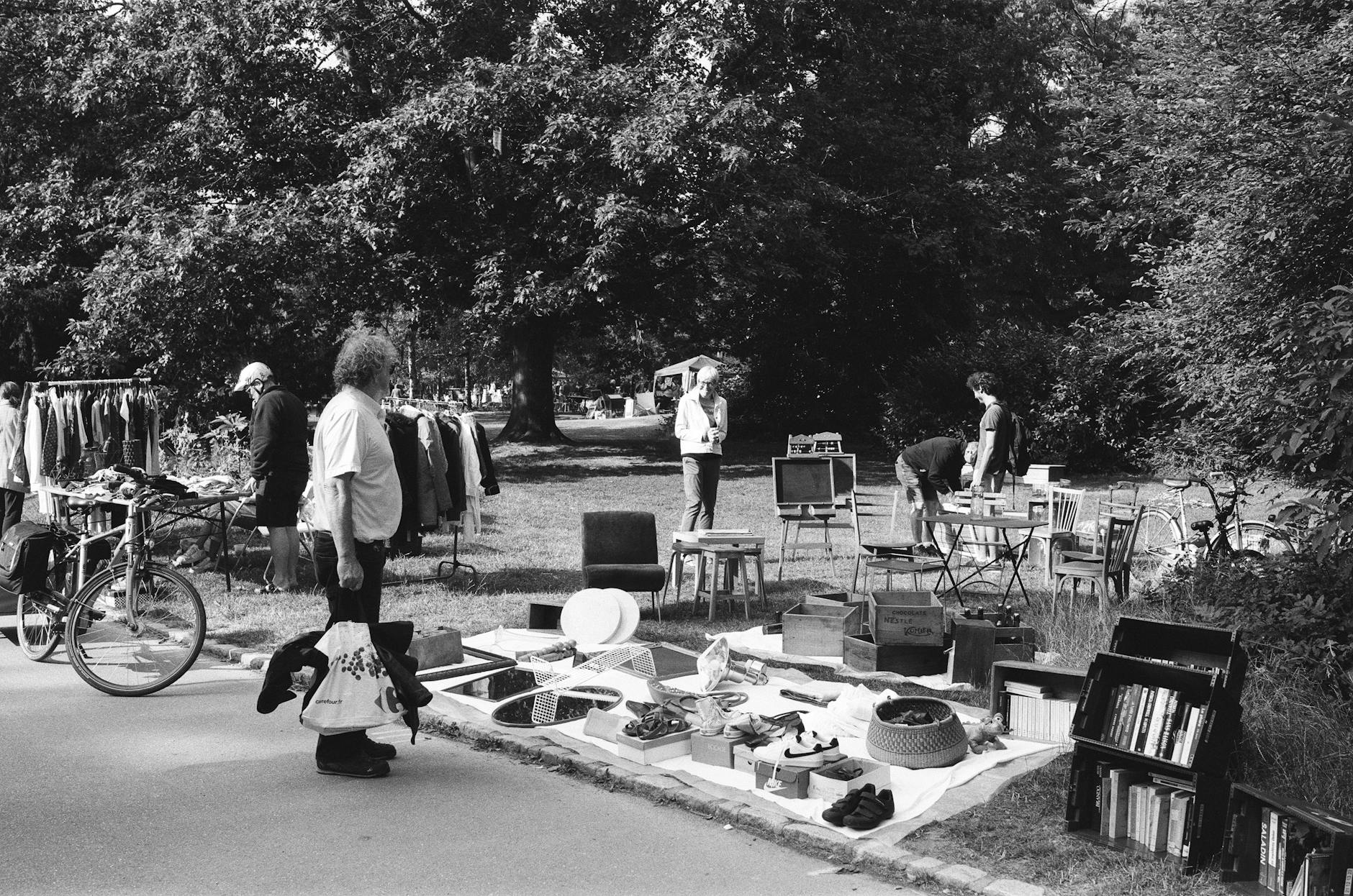 Berlin flea market with vintage stalls and crowds at Mauerpark on a Sunday