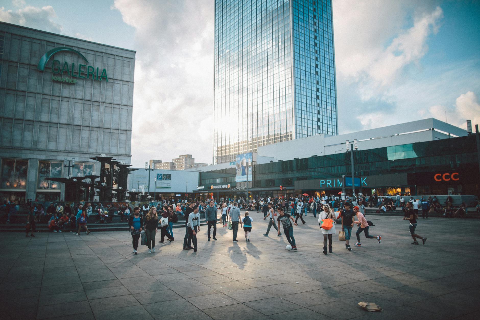 Modern shopping mall interior in Berlin with shoppers and stores