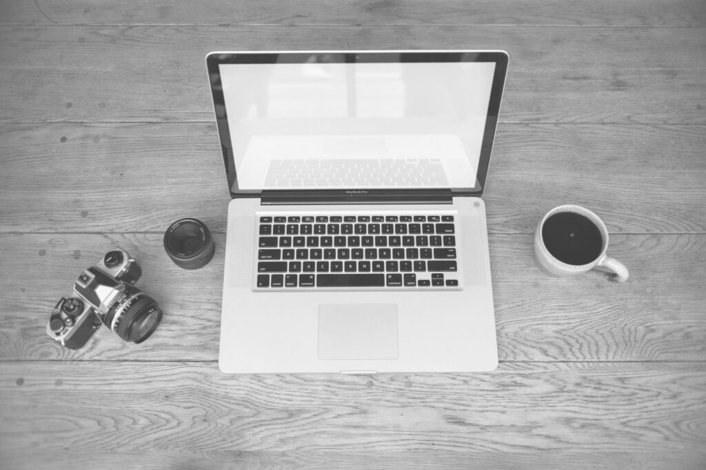 Laptop and coffee cup workspace