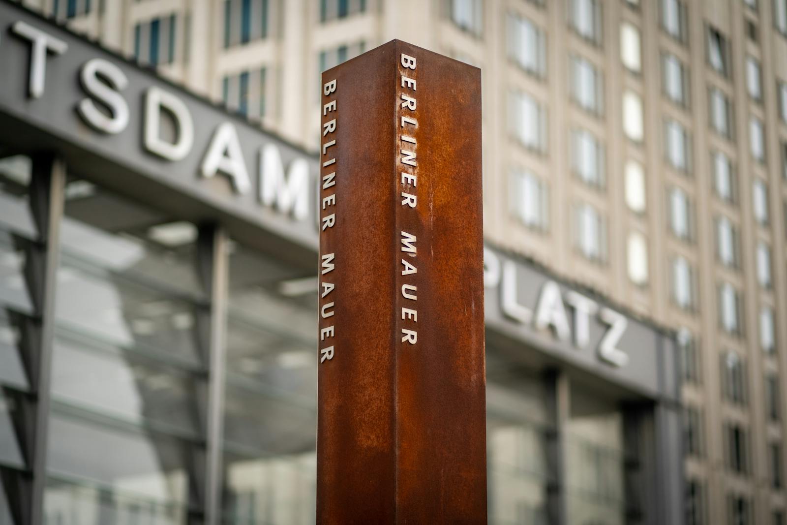 Rusty metal marker showing the line of the Berlin Wall at Potsdamer Platz
