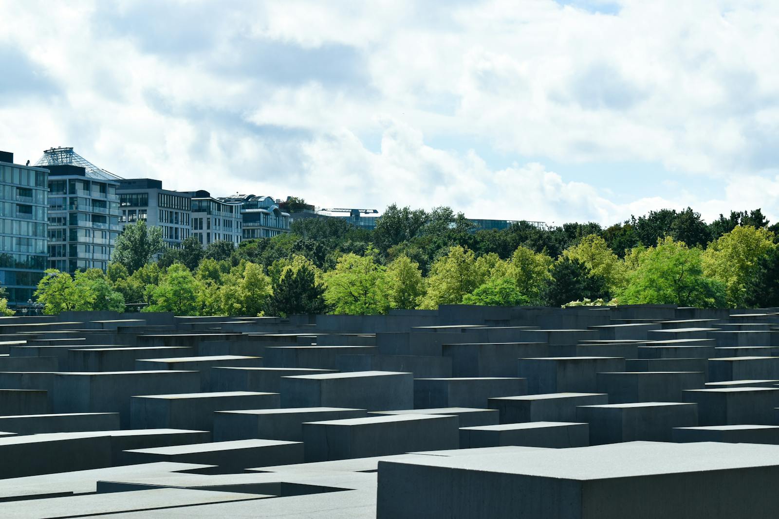 Holocaust Memorial Berlin viewed through trees