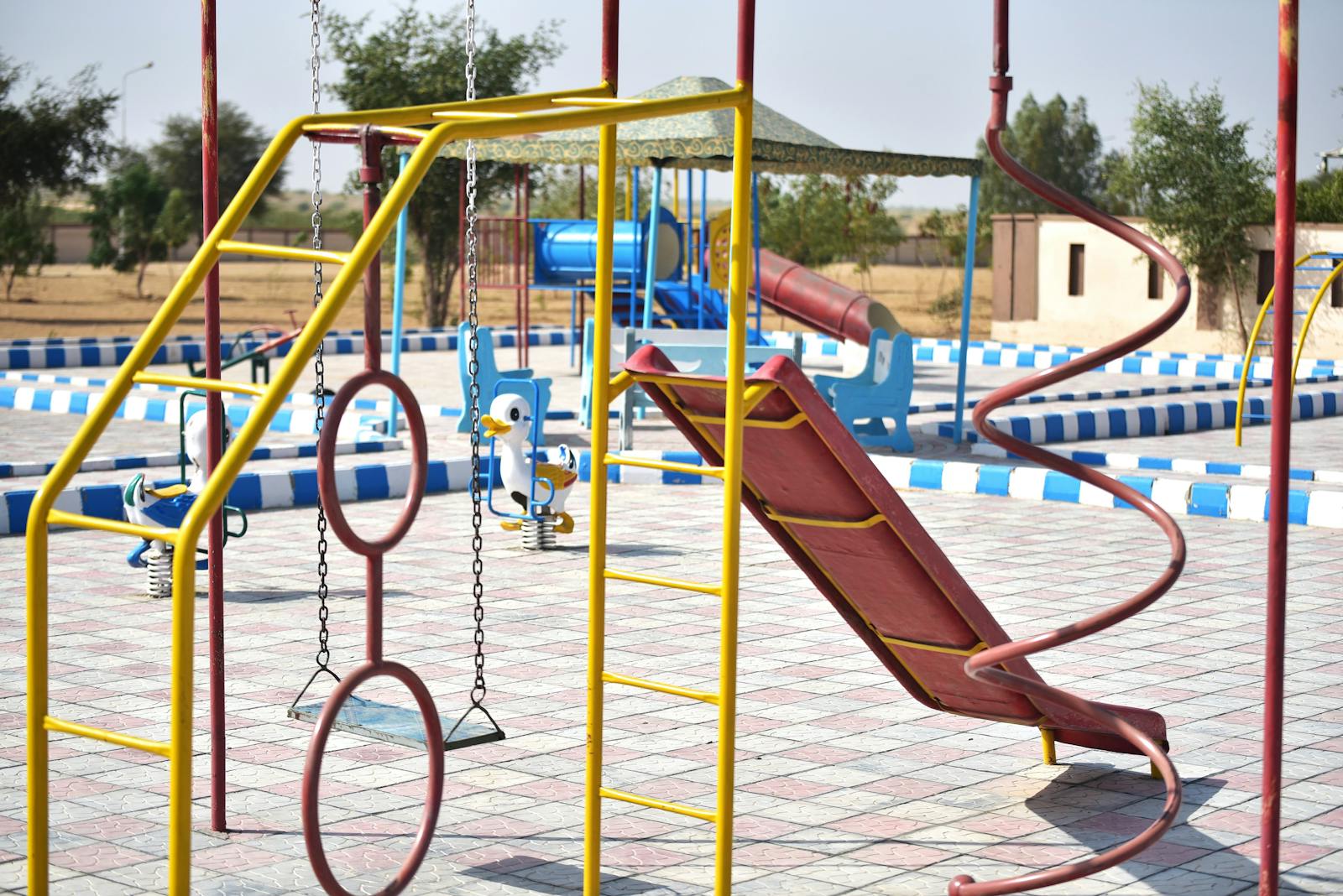 Vibrant outdoor playground with slides and swings