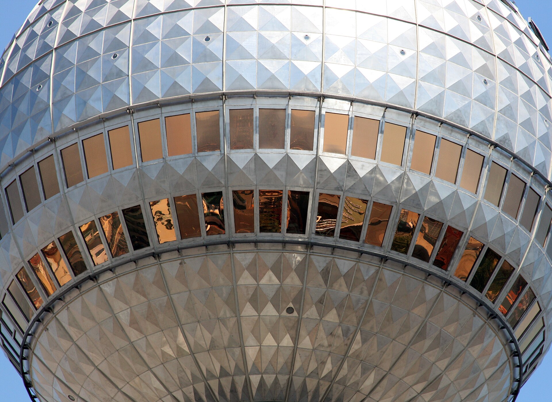 The steel sphere of the Berlin TV Tower seen from below with the two bands of windows for the viewing platform and restaurant