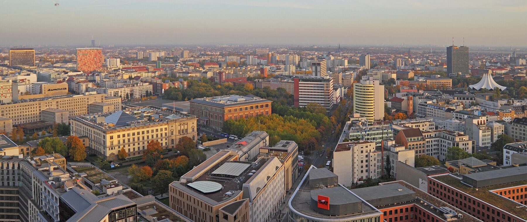 Berlin rooftops and the Tiergarten seen from the Panoramapunkt terrace at Potsdamer Platz at sunset