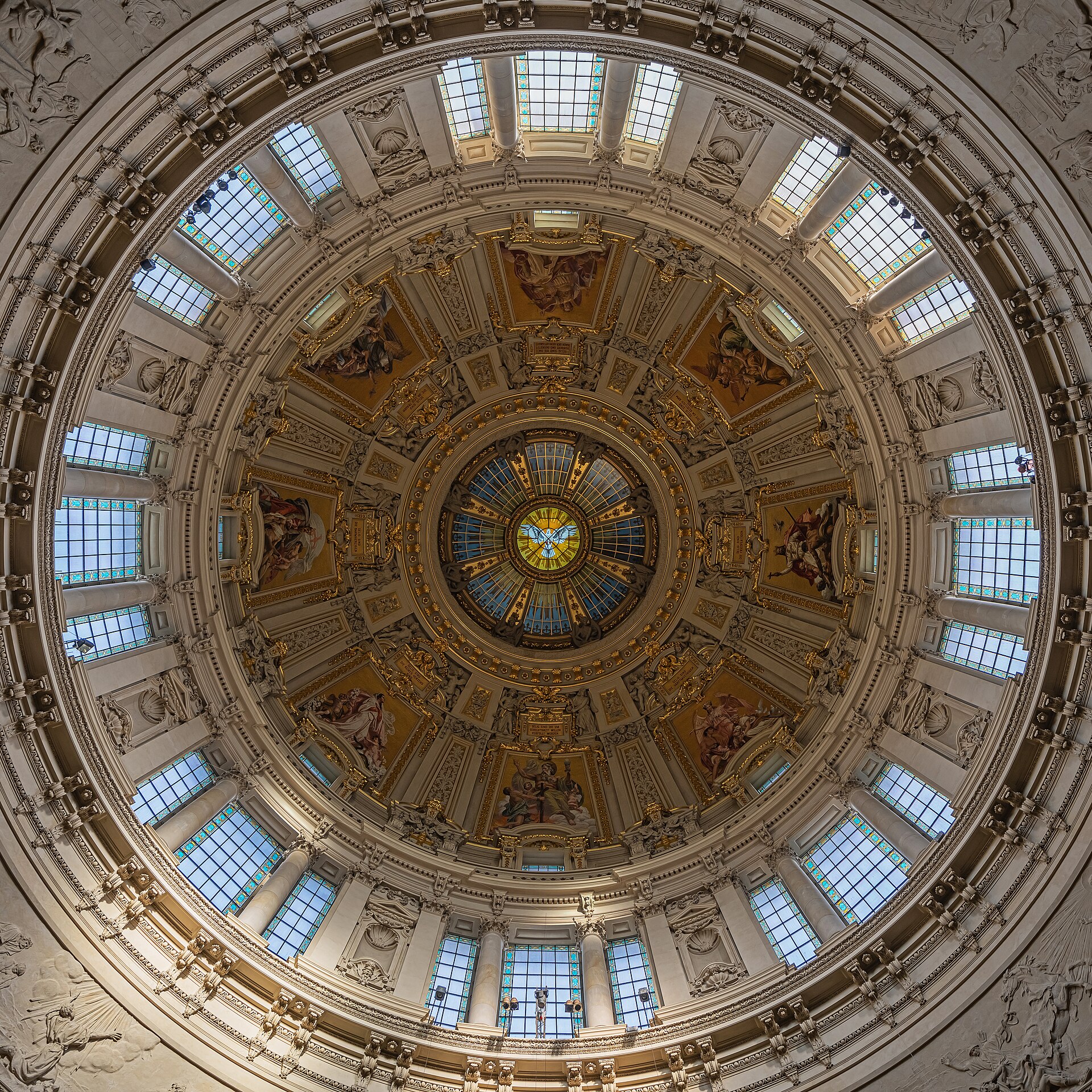 Looking up into the painted and gilded interior of the main dome of Berlin Cathedral