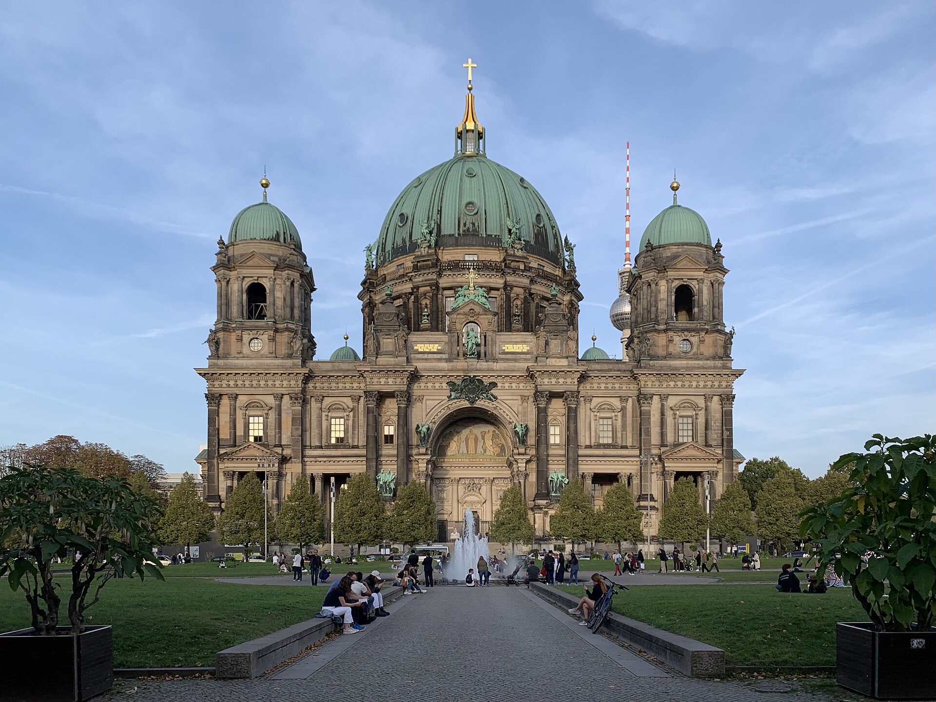 The Berlin Cathedral with its green copper dome seen from the Lustgarten, with the TV Tower visible behind it