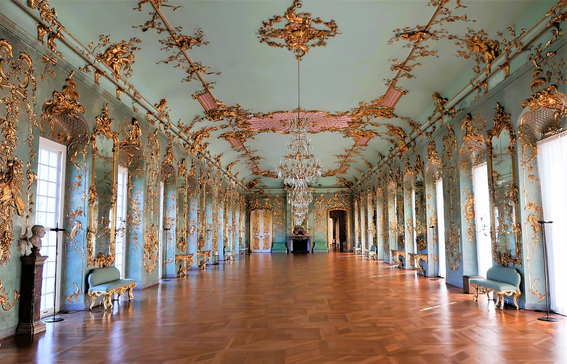 The Golden Gallery at Charlottenburg Palace in Berlin, a long rococo hall in pale green with gilded stucco and mirrors