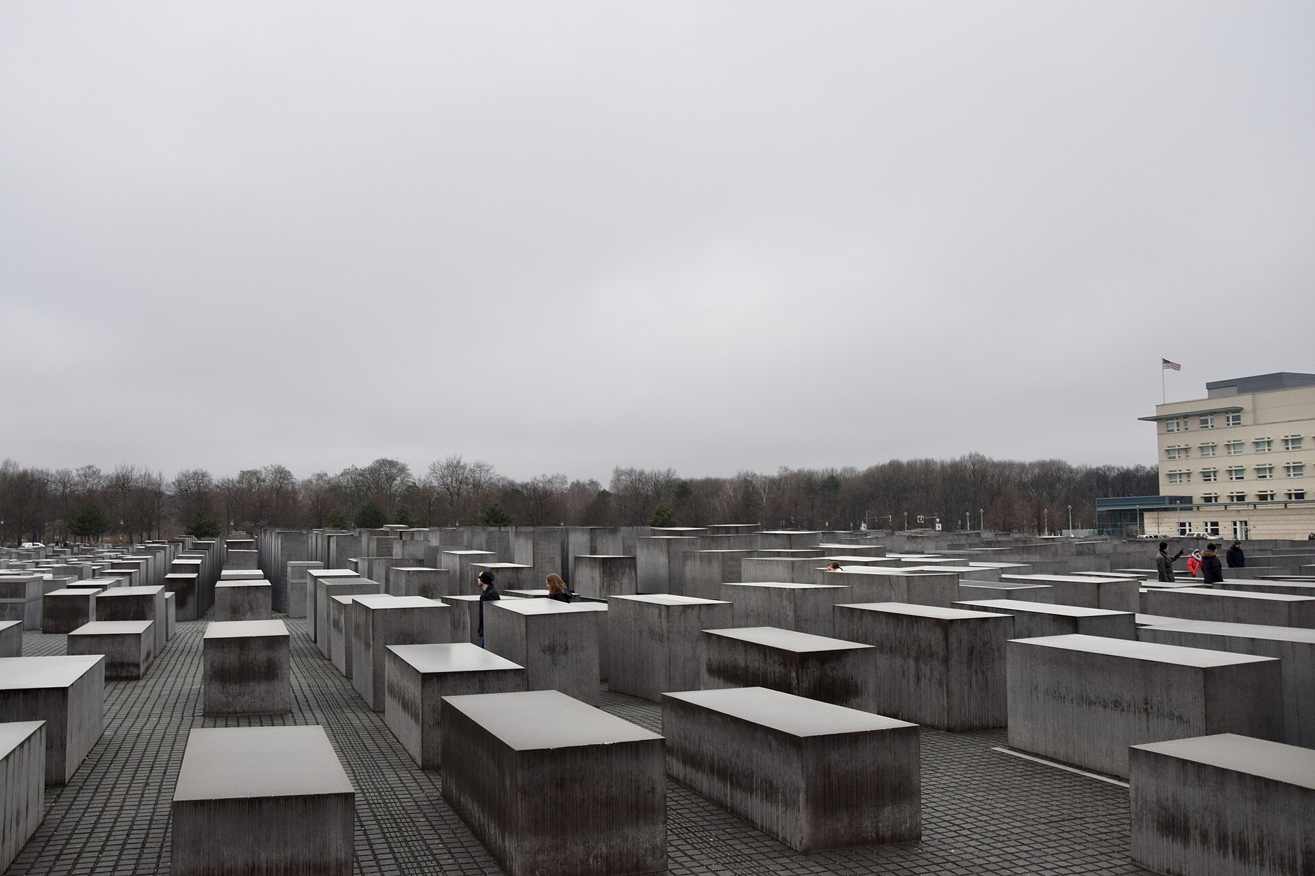 The field of grey concrete stelae at the Memorial to the Murdered Jews of Europe in Berlin on an overcast day