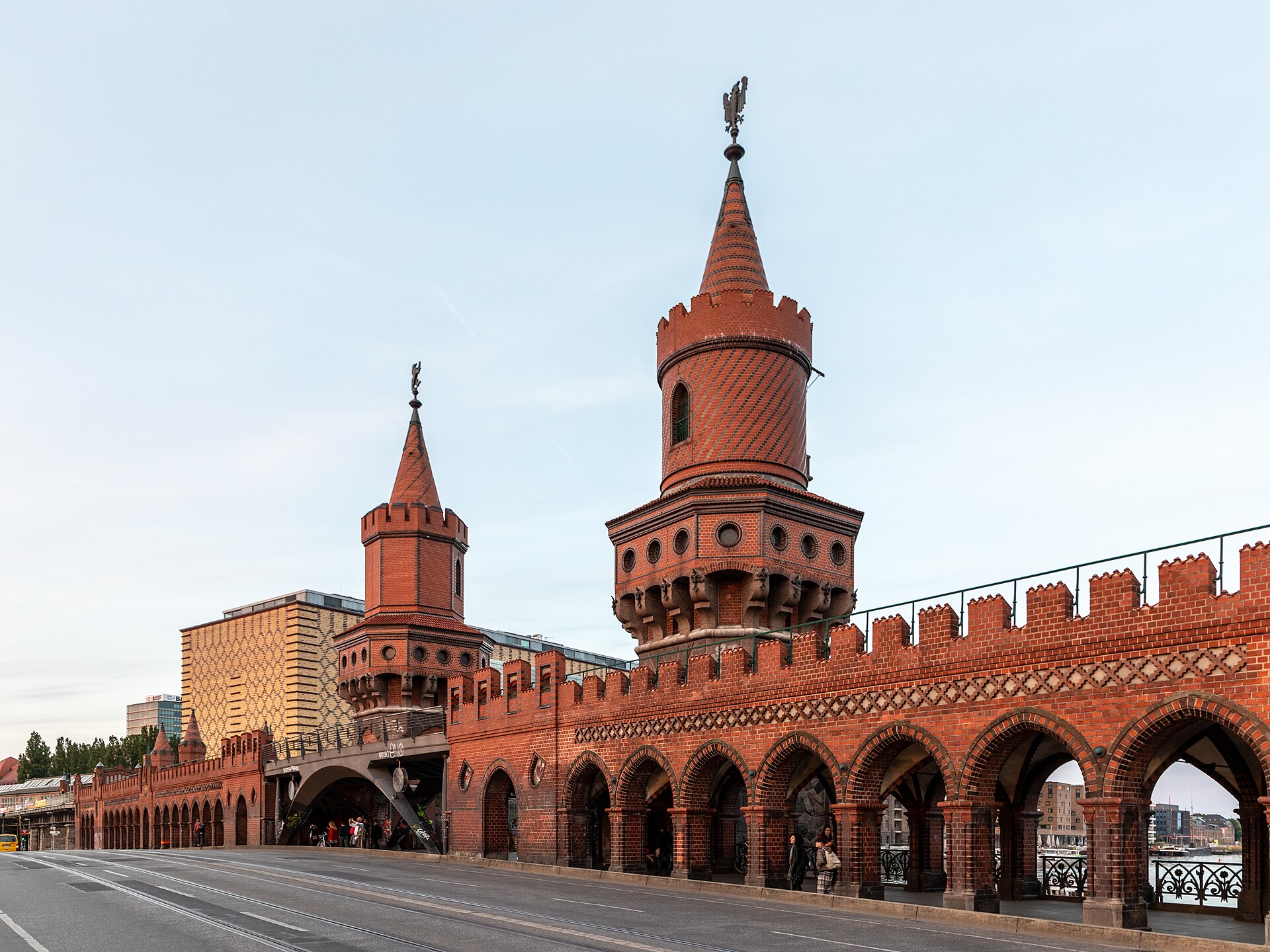 The brick towers and arcaded parapet of the Oberbaumbrücke seen from the road deck