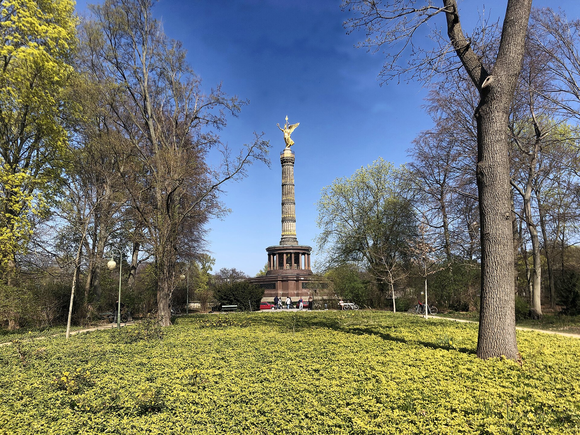 The Siegessäule seen through the trees of the Tiergarten on a bright spring day