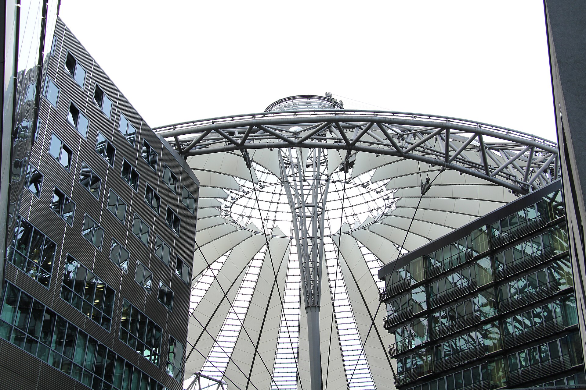 The steel and fabric tented roof of the Sony Center at Potsdamer Platz seen from below during the day