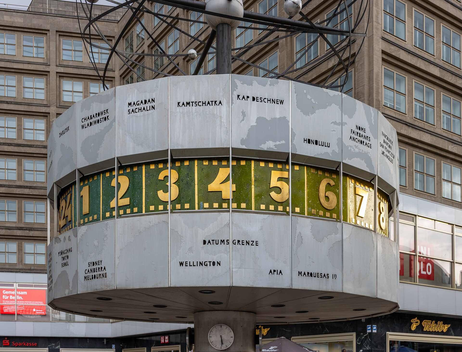 Detail of the Weltzeituhr world time clock on Alexanderplatz showing city names and the hour bands